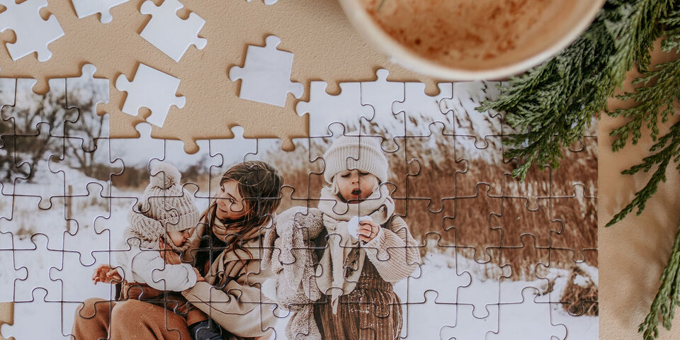 Puzzle with a winter family photo and a cup of coffee